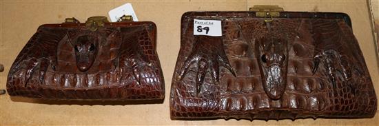 Two Edwardian crocodile clutch bags, largest 11.5in.(-)